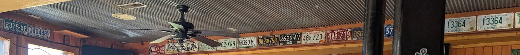 License-plate collection lining the ceiling at Mullets